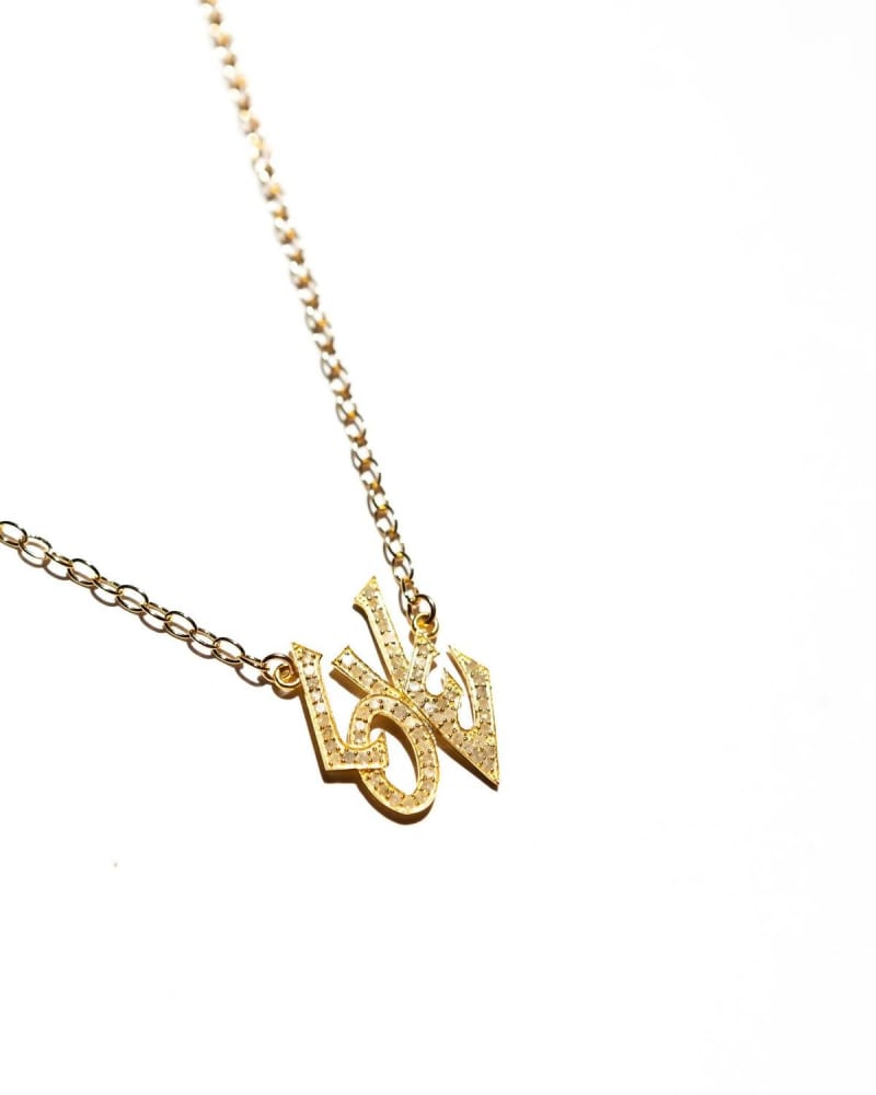 Front of a size O/S Graffiti Love Necklace in Gold in Gold by Paula Rosen. | dia_product_style_image_id:330130